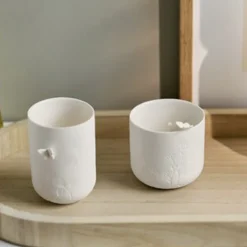Räder fyrfadsstage i porcelæn med sommerfugl på toppen